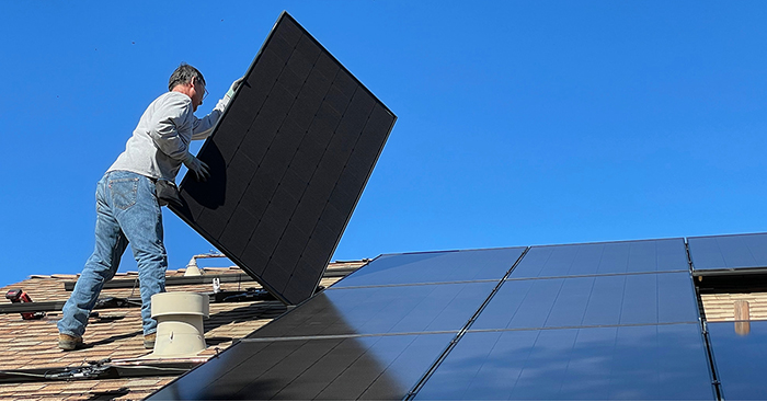 man-installing-solar-panels-on-roof